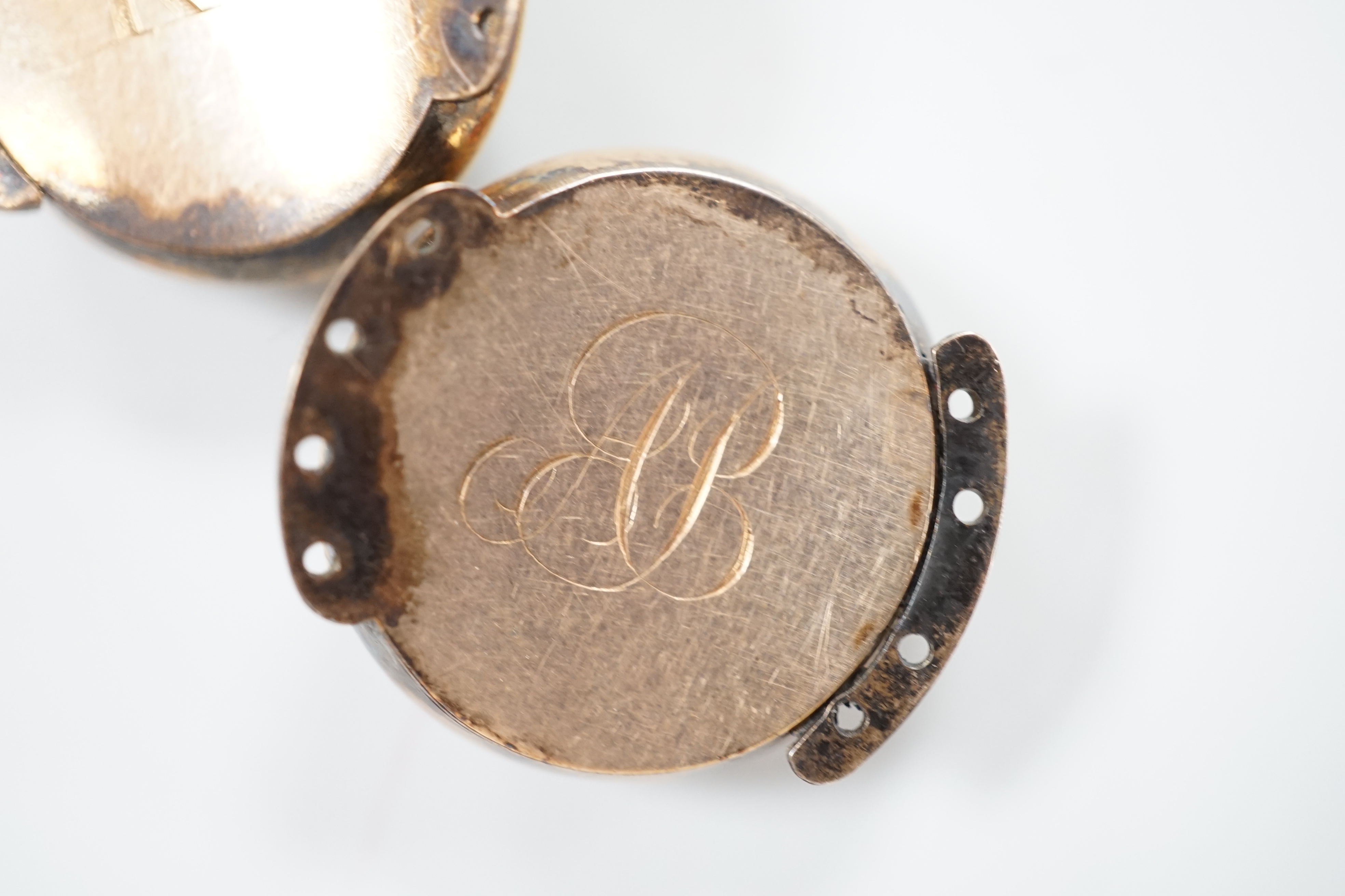 A pair of George III gold, enamel and pearl set clasps, each with differing hairwork inset and differing monogram / initials to the back, 2.25cm